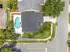 Aerial view of the home with a private pool, patio, and well-maintained landscaping at 554 Queensbridge Dr, Lake Mary, FL 32746