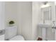 Powder room features a pedestal sink and a toilet at 554 Queensbridge Dr, Lake Mary, FL 32746