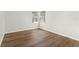 Vacant bedroom with hardwood floors and natural light from a pair of windows at 554 Queensbridge Dr, Lake Mary, FL 32746