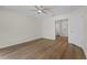 Bright bedroom with wood look floors and a ceiling fan, offering ample space at 554 Queensbridge Dr, Lake Mary, FL 32746