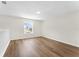 Empty bonus room with hardwood floors and natural light coming through the window at 554 Queensbridge Dr, Lake Mary, FL 32746