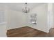 Cozy dining room featuring modern flooring and a stylish chandelier at 554 Queensbridge Dr, Lake Mary, FL 32746