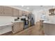 Well-equipped kitchen featuring stainless steel appliances and wooden cabinets at 554 Queensbridge Dr, Lake Mary, FL 32746