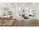Bright, open-concept living space featuring soaring ceilings and access to the kitchen and dining area at 554 Queensbridge Dr, Lake Mary, FL 32746