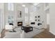 Bright living room featuring a fireplace, soaring ceilings, neutral color palette, and lots of natural light at 554 Queensbridge Dr, Lake Mary, FL 32746