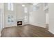 Bright living room featuring a fireplace, soaring ceilings, neutral color palette, and lots of natural light at 554 Queensbridge Dr, Lake Mary, FL 32746