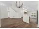 Bright, open living space with view of the staircase and breakfast bar at 554 Queensbridge Dr, Lake Mary, FL 32746