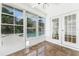 A sunroom featuring views of the pool and access to the outside with tiled floors at 554 Queensbridge Dr, Lake Mary, FL 32746
