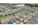 Aerial view of the home and community featuring a view of the amenity center with swimming pool and pond at 5641 Oak Knoll Dr, St Cloud, FL 34771