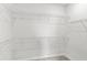 Empty walk-in closet with metal shelving, ready for your personal organization and storage at 5641 Oak Knoll Dr, St Cloud, FL 34771
