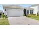 Beautiful home with brick paved driveway and attached two car garage at 5641 Oak Knoll Dr, St Cloud, FL 34771