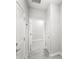 Bright hallway featuring light-colored wood floors and white doors at 5641 Oak Knoll Dr, St Cloud, FL 34771