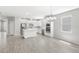 Modern kitchen with white cabinets, stainless steel appliances, and center island at 5641 Oak Knoll Dr, St Cloud, FL 34771