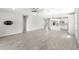 Spacious open concept living room and kitchen with gray tile floors at 5641 Oak Knoll Dr, St Cloud, FL 34771