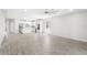 Open concept living room and kitchen with tile floors and modern ceiling fan at 5641 Oak Knoll Dr, St Cloud, FL 34771