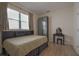 Cozy bedroom boasts natural light and stylish furniture at 5908 Paxton Ct, Apopka, FL 32703