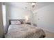 This bedroom features neutral walls, and a comfortable bed, and has an open doorway at 5908 Paxton Ct, Apopka, FL 32703