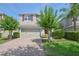 Charming two-story home with red door and shutters, two-car garage, and landscaped front yard at 5908 Paxton Ct, Apopka, FL 32703