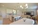 Bright, open kitchen and dining area with stainless steel appliances, granite countertops, and a view to the living room at 5908 Paxton Ct, Apopka, FL 32703