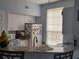 Efficient kitchen layout with modern appliances and a breakfast bar at 6316 Raleigh St # 401, Orlando, FL 32835