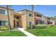 Apartment building with lawn, sidewalks and colorful facade at 648 Kenwick Cir # 102, Casselberry, FL 32707