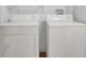 A laundry area showcasing a white washer and dryer at 648 Kenwick Cir # 102, Casselberry, FL 32707