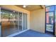 The patio features a sliding glass door and a screen door at 648 Kenwick Cir # 102, Casselberry, FL 32707
