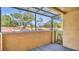A covered patio with a view of trees and a parking lot at 648 Kenwick Cir # 102, Casselberry, FL 32707