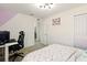 Bright bedroom with a bed, a desk, and closet space at 700 Trotters Dr, Eagle Lake, FL 33839
