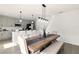 Well-lit open concept kitchen featuring a large island, modern appliances, and a connected dining area at 700 Trotters Dr, Eagle Lake, FL 33839