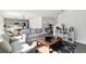 Bright living room featuring modern decor, with an open floor plan connecting to the kitchen and dining area at 700 Trotters Dr, Eagle Lake, FL 33839