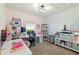 Bright home office setup with multiple desks, shelving, and a window offering natural light at 700 Trotters Dr, Eagle Lake, FL 33839