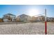 Beach volleyball court with nearby homes and clear sky in the distance, providing a fun recreational amenity at 700 Trotters Dr, Eagle Lake, FL 33839