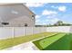 Beautiful backyard featuring putting green, green grass, and access from a stone tile patio at 701 Dennis Ave, Orlando, FL 32807