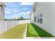 Clean and well maintained backyard has putting green and beautiful views from rear windows at 701 Dennis Ave, Orlando, FL 32807