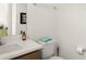 Modern half bathroom with a toilet, sink, and a white countertop, conveniently located at 701 Dennis Ave, Orlando, FL 32807
