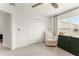 Well-lit Bedroom featuring a comfortable armchair and changing table with a scenic view at 701 Dennis Ave, Orlando, FL 32807