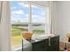 Bright Bedroom with a changing table, large window, and scenic lake view at 701 Dennis Ave, Orlando, FL 32807