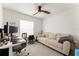 Well-lit bedroom with a ceiling fan, and comfortable seating area for relaxing at 701 Dennis Ave, Orlando, FL 32807