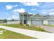 Charming two-story home features a well-manicured lawn, a two-car garage, and a delightful, welcoming facade at 701 Dennis Ave, Orlando, FL 32807