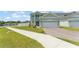 Beautiful two-story home featuring a paved driveway, well-maintained landscaping, and an attached garage at 701 Dennis Ave, Orlando, FL 32807
