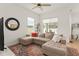 Inviting living room featuring a comfortable sectional sofa, stylish decor, and abundant natural light at 701 Dennis Ave, Orlando, FL 32807
