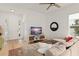 Comfortable living room with a TV, stylish furniture, and view to front door and entry at 701 Dennis Ave, Orlando, FL 32807