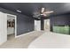Spacious main bedroom featuring a walk-in closet, ensuite bathroom, and neutral decor at 701 Dennis Ave, Orlando, FL 32807