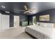 Serene main bedroom featuring a spacious layout, neutral decor, and ensuite bathroom at 701 Dennis Ave, Orlando, FL 32807
