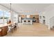 Open-concept with dining area leading to a modern kitchen with stainless steel appliances at 701 Dennis Ave, Orlando, FL 32807