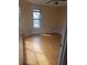 Bedroom with wood flooring, a window, and a ceiling fan with light fixture at 706 Lighthouse Ct, Altamonte Springs, FL 32714