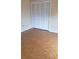 Bedroom with a closet with louvered doors and wood flooring at 706 Lighthouse Ct, Altamonte Springs, FL 32714