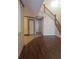 Front entryway with wood flooring and tile that leads into a two-story foyer at 706 Lighthouse Ct, Altamonte Springs, FL 32714