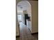 A kitchen area leading to a dining area with tile flooring at 706 Lighthouse Ct, Altamonte Springs, FL 32714